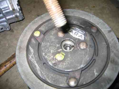 thread in a bolt to press of the pulley, IIRC it's a 5/8-11
