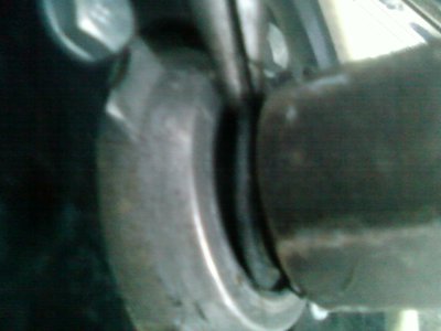 little rubber ring pulled back to try to reveal the inner threads